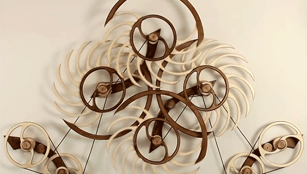 Spring-driven kinetic wood sculptures by David C. Roy