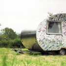 Old CDs and vinyl records are used to revamp this deluxe caravan