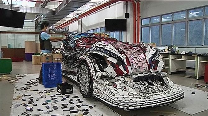 life-size model of a Formula 1 racecar from 25,000 recycled mobile phones
